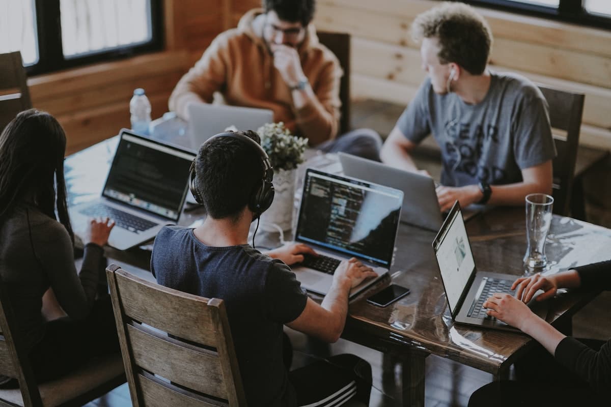 A cross-disciplinary student team collaborating on a real industry brief